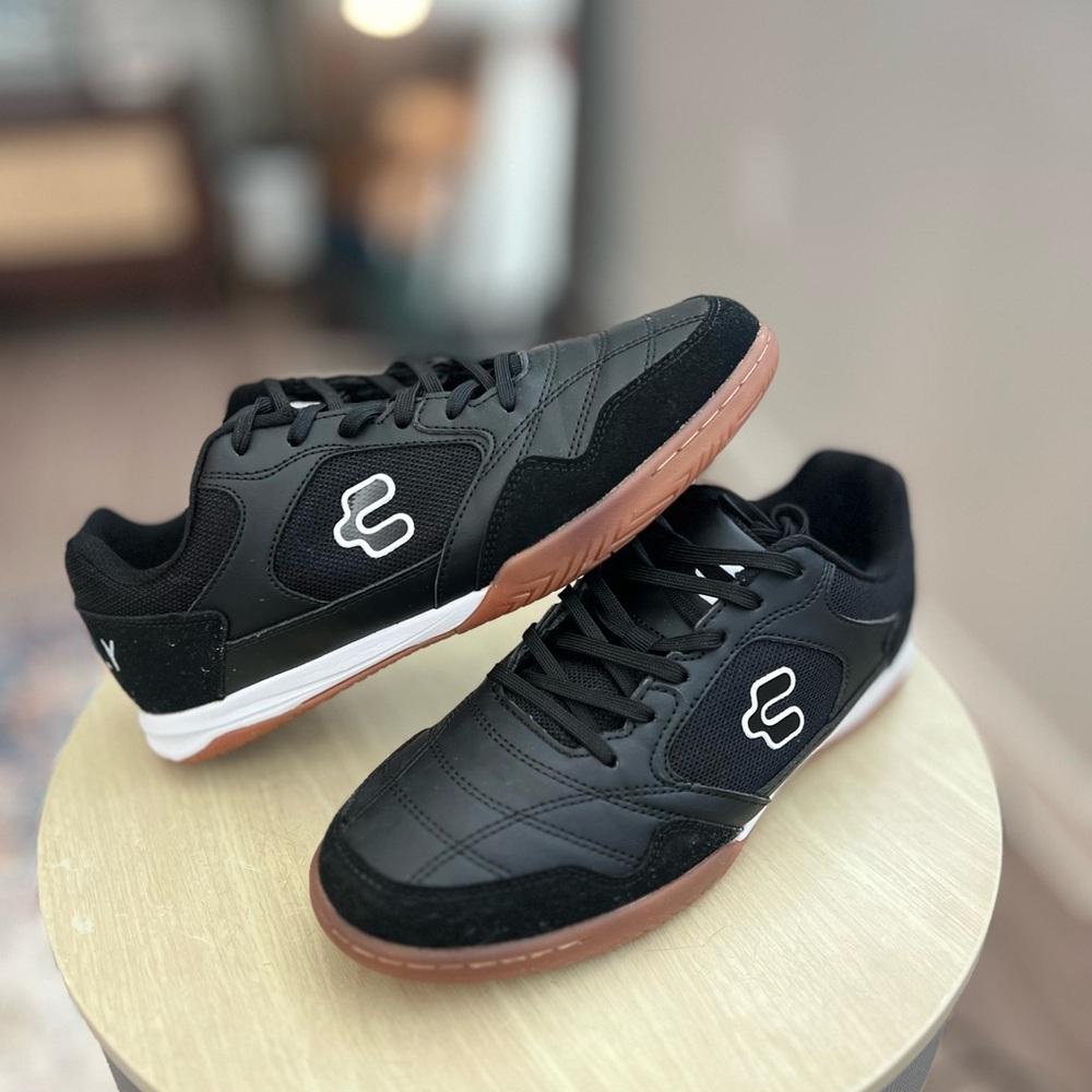 Sleek Black and White Athletic Shoes with Skate-Inspired Design